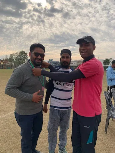 With athletes at the ground