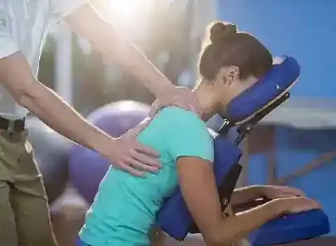 Physiotherapist working on a patient's neck and shoulders